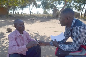 JohnPaulKauyni-interviews-groundnut-farmer-in-Mchinji---BW-writers-workshop